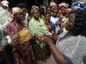Amaka Nneji, coordinator of the female condom in Lagos, Nigeria, explains how to use female condoms. Photo by Robert Bodegraven